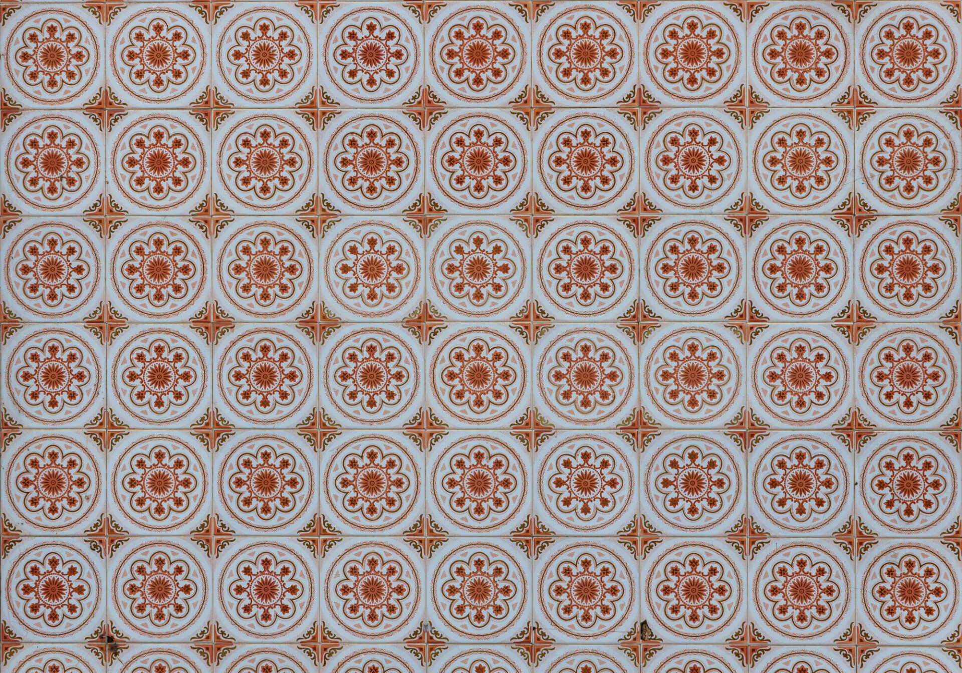 Old fashioned tile texture with orange flowers