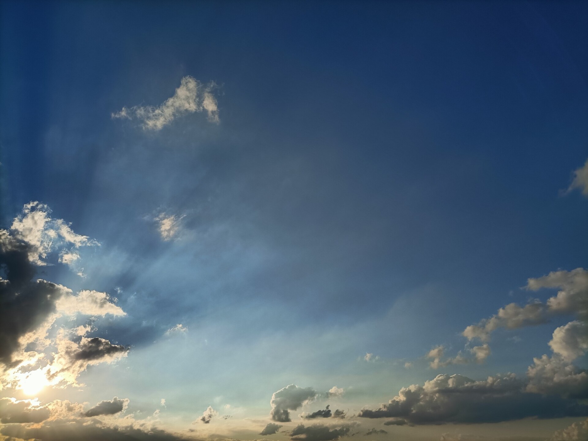 Epic Sky with the Sun behind a Cloud