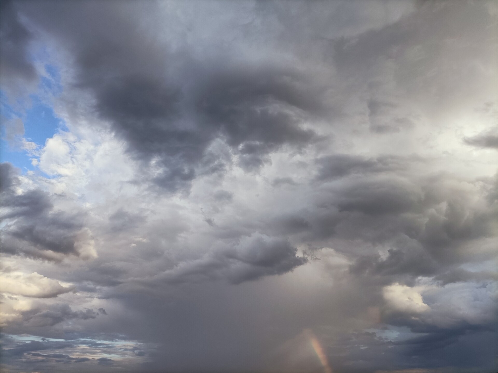 Beautiful Cloudy Sky with a Rainbow