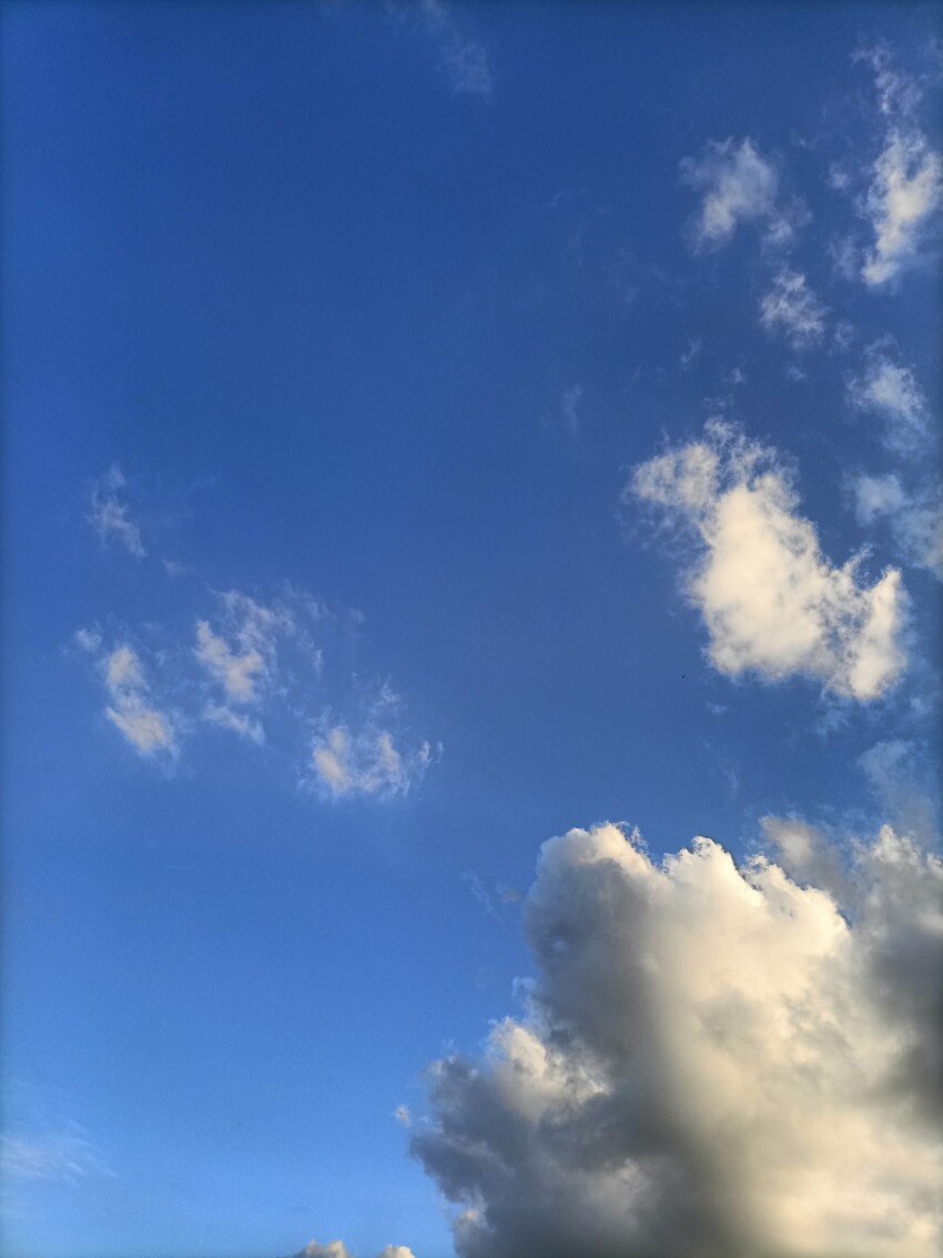 Vertical Sky with some clouds on a blue sky