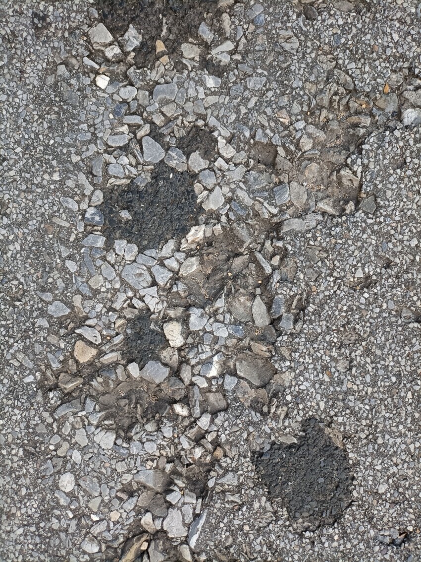 Broken asphalt street texture