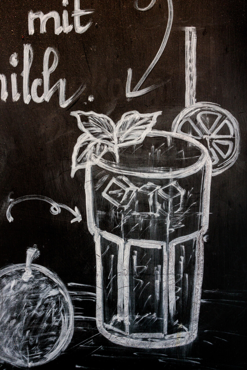 Caipirinha cocktail drawn with chalk on a blackboard