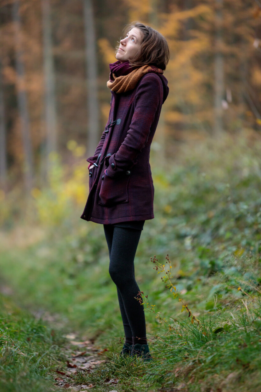 Young woman in autumn clothes in the Forest