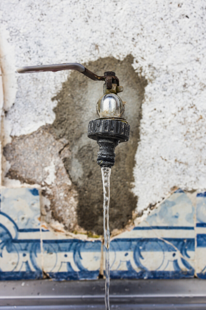 Old tap with running water