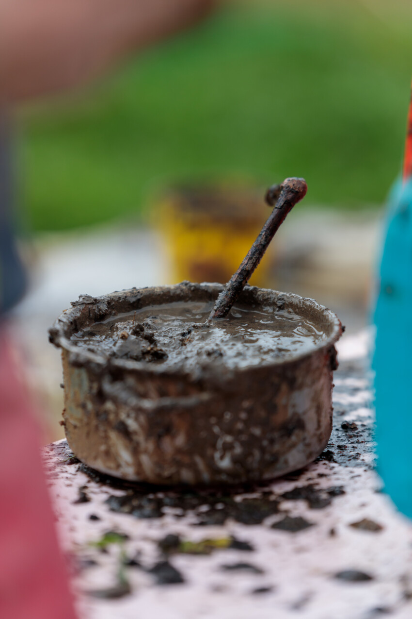 Children cooking with mud