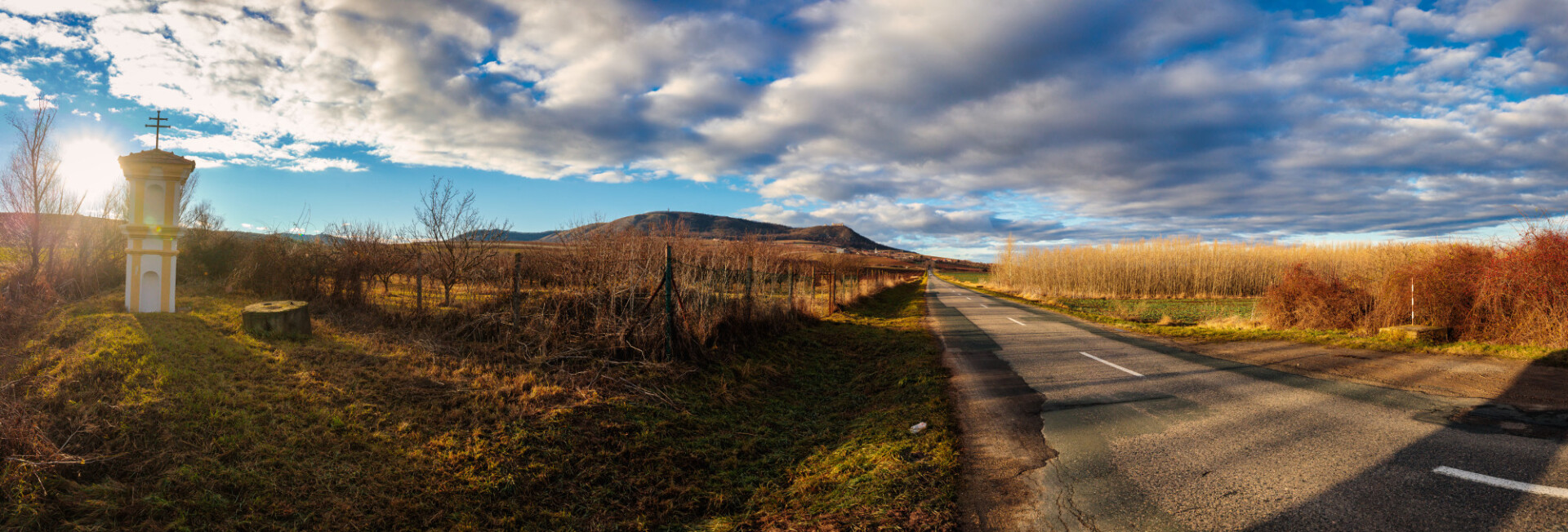 Country road in the Czech Republic with prayer shrine at the side