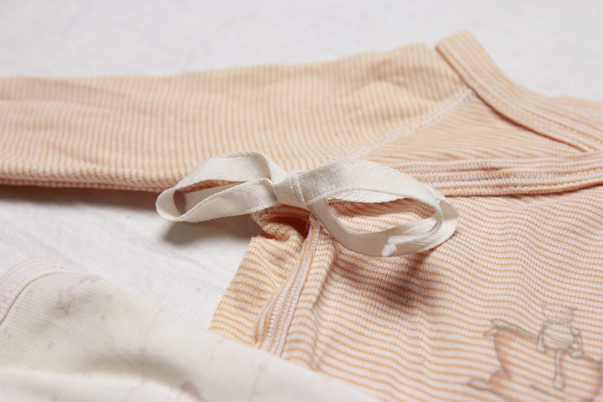 Ribbon on romper for babies