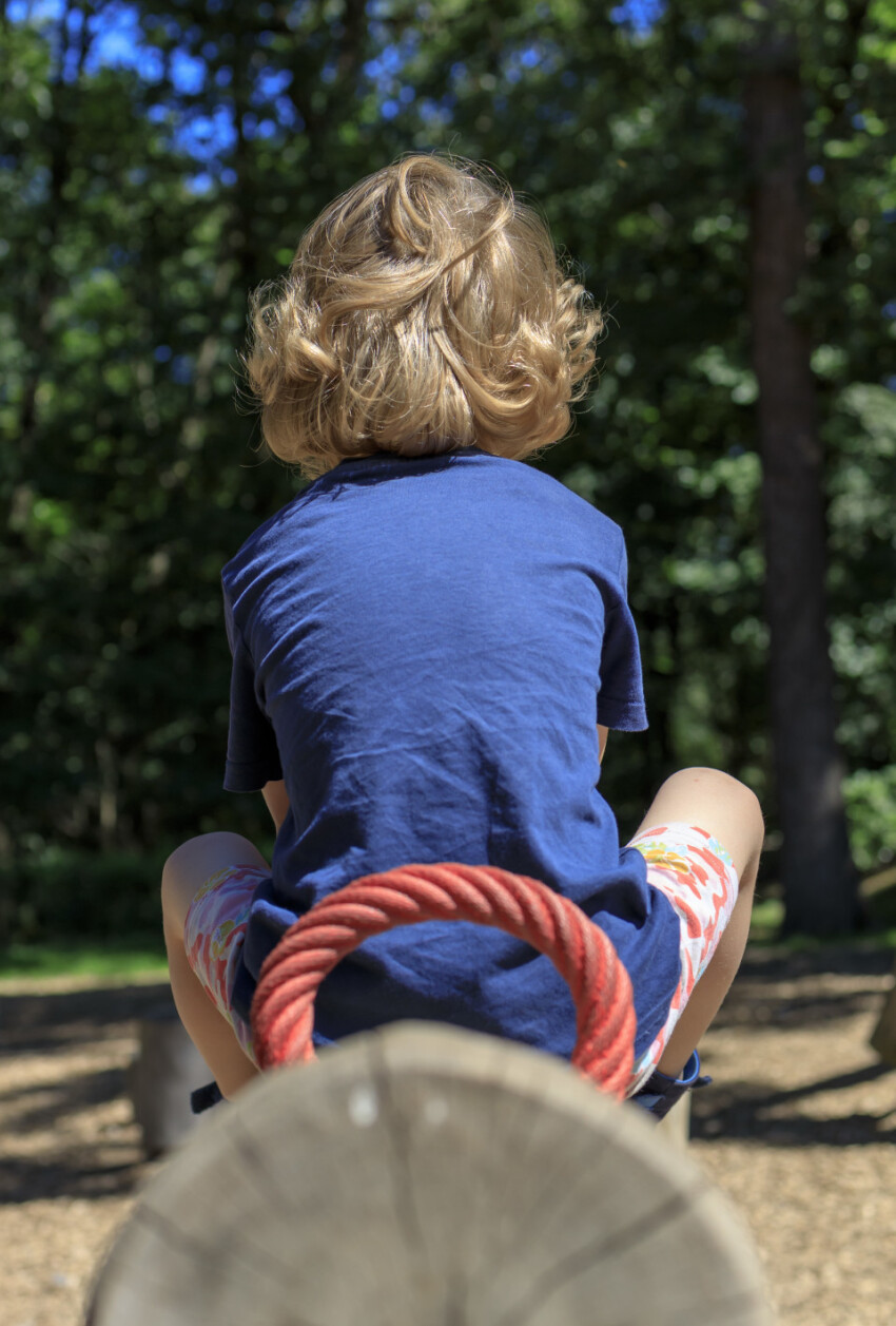 Child on a seesaw