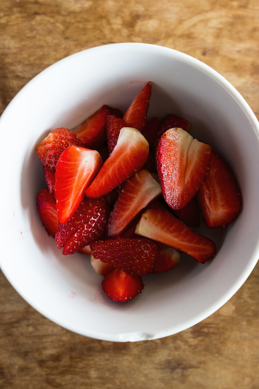 sliced strawberries in a bowl