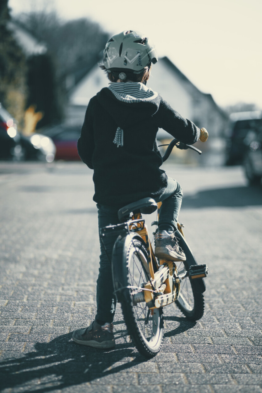 Little boy sitting on his bicycle