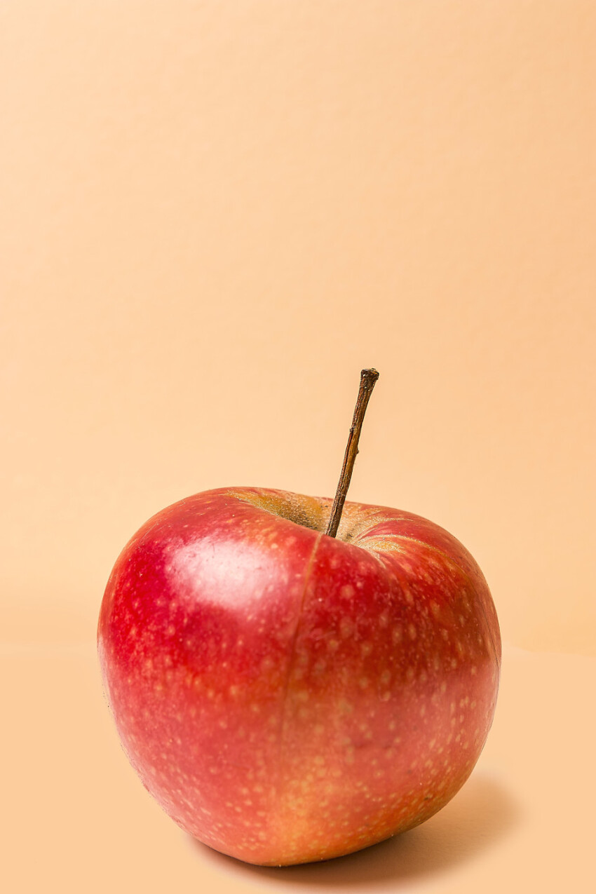 red apple beige background