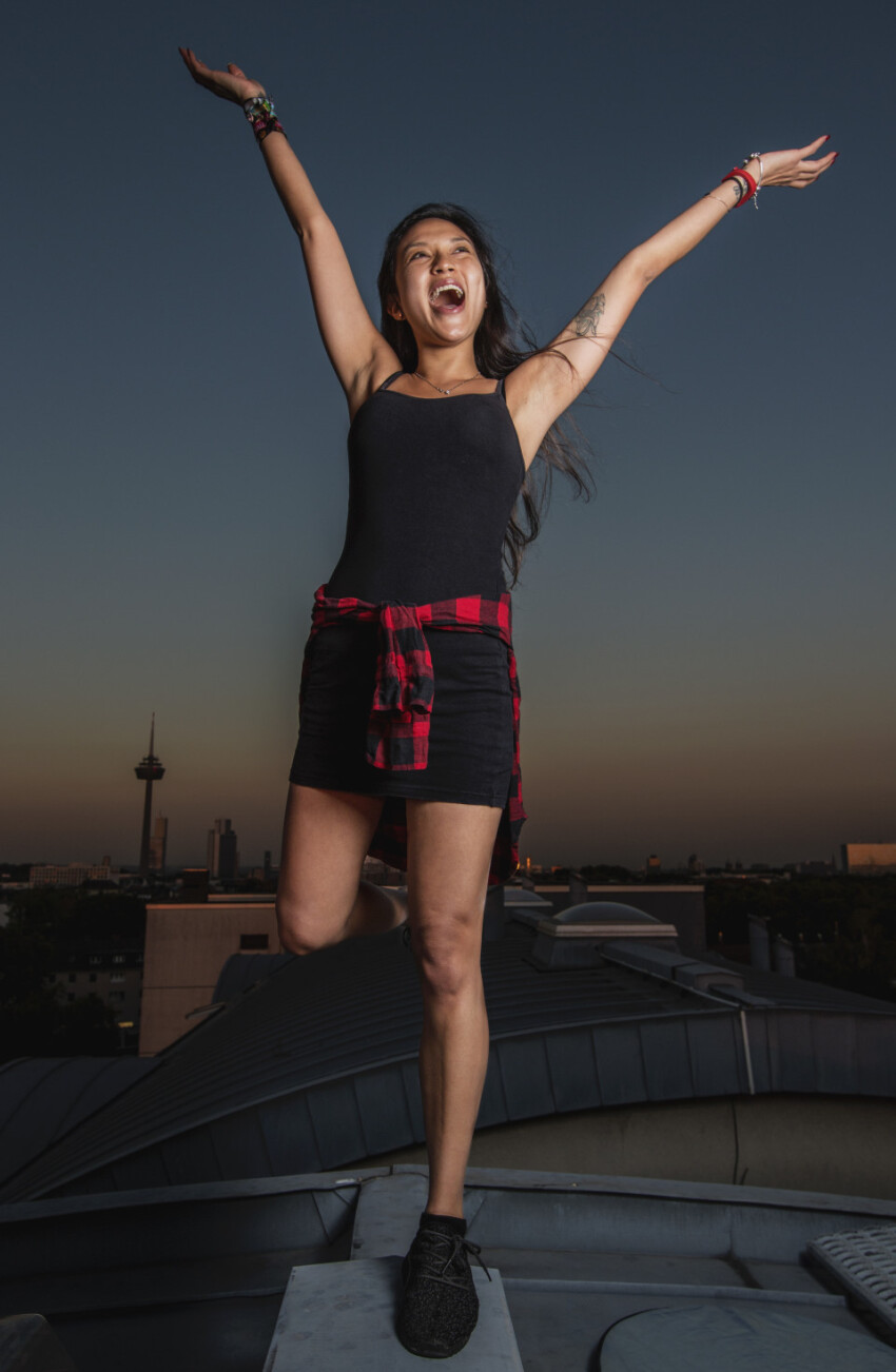 Happy young woman cheers