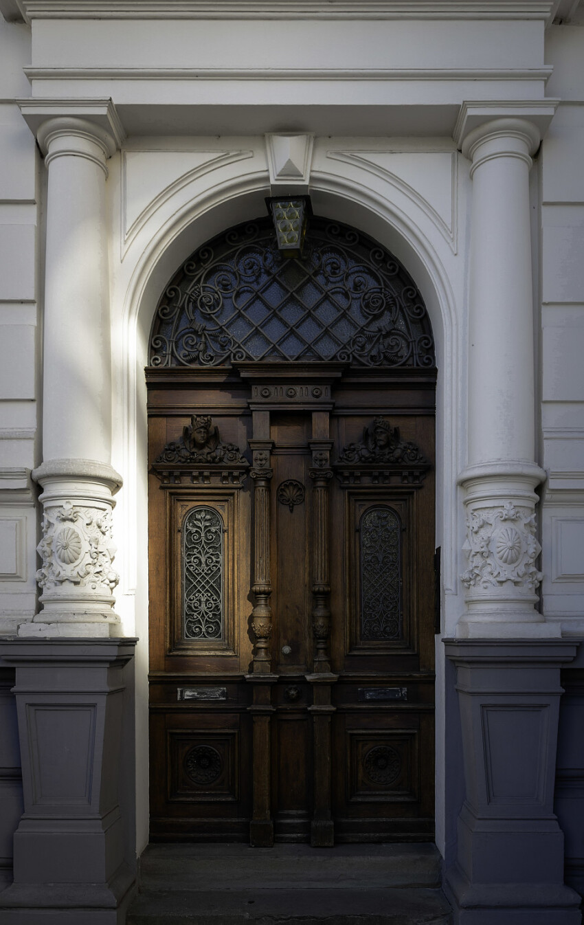 wooden door old white house