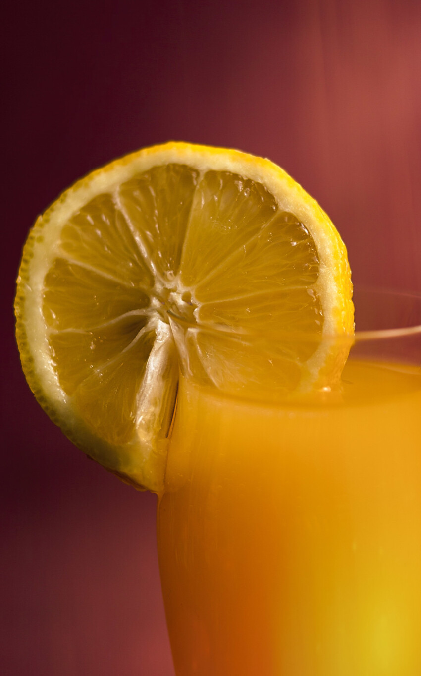 lemon and glass of orange juice