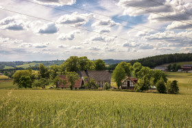 Stock Image: A beautiful organic farm in Germany under a blue sky