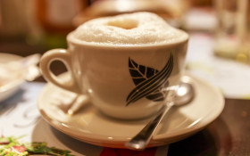 Stock Image: A cup of cappuccino in a cafe
