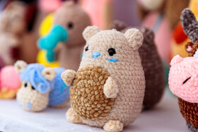 Stock Image: Adorable Handcrafted Delight: Crocheted Hamster at a Handmade Market