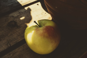 Stock Image: apple on a garden table