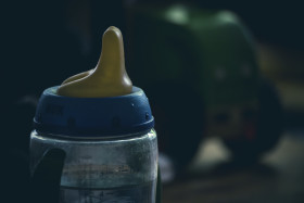 Stock Image: baby bottle filled with water