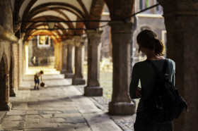 Stock Image: back view of a female tourist in lubeck