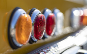 Stock Image: Backlights of a yellow classic car