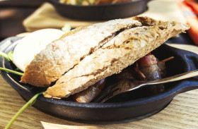 Stock Image: bacon wrapped dates with baguette slices