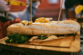 Stock Image: Baguette with melted cheese and fried chicken fillet