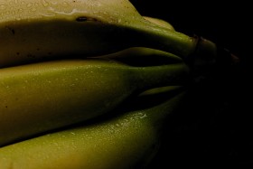 Stock Image: bananas wet black background