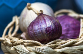 Stock Image: basket full of garlic closeup