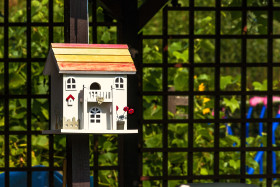 Stock Image: beautiful bird house with colorful roof