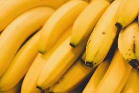 Stock Image: beautiful yellow bananas from the market background