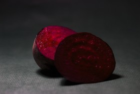 Stock Image: Beetroot sliced on dark background