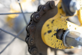 Stock Image: Bicycle chain on a yellow children's bike
