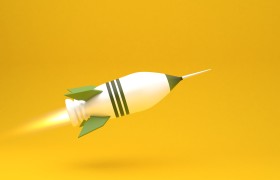 Stock Image: big green rocket on yellow background