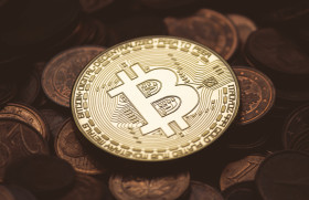 Stock Image: Bitcoin between euro coins