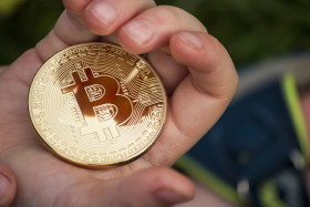 Stock Image: bitcoin coin children hands
