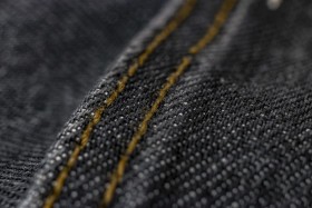 Stock Image: black jeans fabric texture
