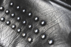 Stock Image: black leather with rivets