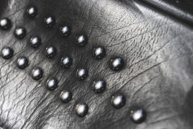 Stock Image: black leather with rivets