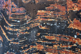 Stock Image: Black metal texture with rusty scratches