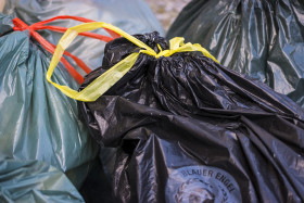 Stock Image: blue and black sack garbage