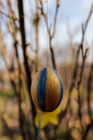 Stock Image: Blue and gold striped decorated Easter egg