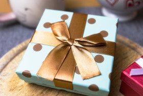 Stock Image: blue golden spotted birthday present