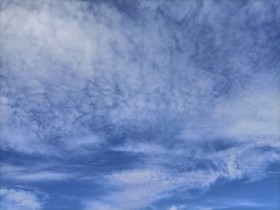 Stock Image: Blue sky with soft White Clouds