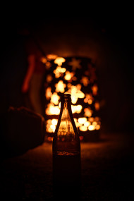 Stock Image: Bottle by the campfire