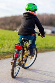 Stock Image: Boy riding bike in a helmet