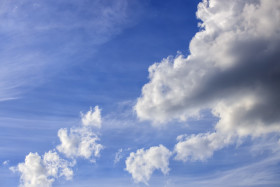 Stock Image: Bright beautiful blue sky with soft clouds, bright sunny day
