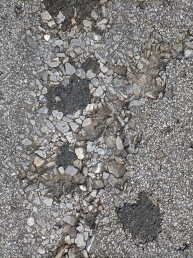 Stock Image: Broken asphalt street texture