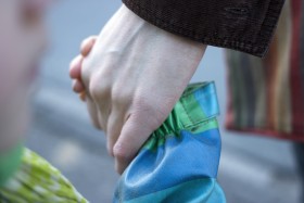 Stock Image: Child holding mother's hand