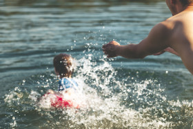 Stock Image: child is thrown into the water